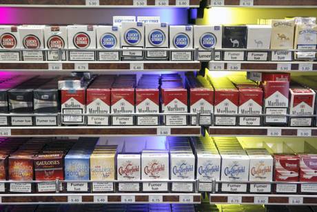 epa02436701 View of cigarette boxes in a tobacconist in Paris, France, 08 November 2010. The price of tobacco rose 6 percent in France, meaning the cheapest cigarettes will now cost 5.40 euro (7.51 US dollars).  EPA/LUCAS DOLEGA