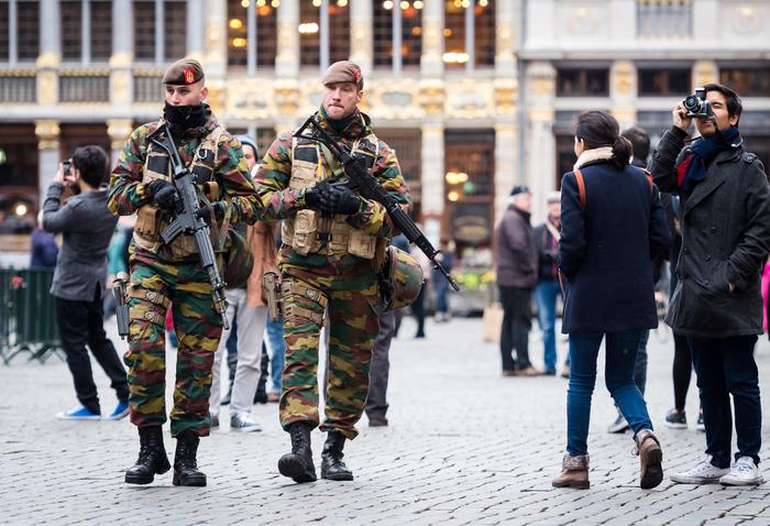 Belgian Army soldiers patrol in the picturesque Grand Place in the center of Brussels on Friday, Nov. 20, 2015.  Salah Abdeslam, a French national who lived in Molenbeek, Belgium, is currently the subject of an international manhunt after the Paris attacks. Security has been stepped up in parts of Belgium as a precaution. (ANSA/AP Photo/Geert Vanden Wijngaert)
