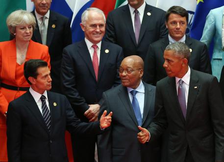 epa05523269 (top row L-R) British Prime Minister Theresa May, Australian Prime Minister Malcolm Turnbull, Italian Prime Minister Matteo Renzi; (bottom row L-R) Mexican President Enrique Pena Nieto, South African President Jacob Zuma, and US President Barack Obama during a family photo during the G20 Summit in Hangzhou, China, 04 September 2016. The G20 Summit is held in Hangzhou on 04 to 05 September.  EPA/HOW HWEE YOUNG