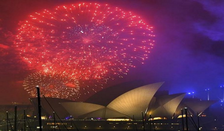 Fireworks explode over the Opera House during New Year's Eve celebrations in Sydney, Australia, Sunday, Dec. 31, 2017. (David Moir/AAP Image via AP)