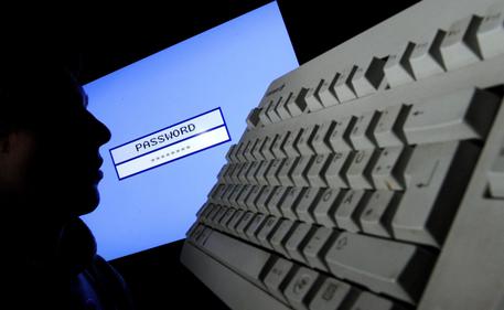 epa04034669 A file photo dated 23 January 2012 and made available on 21 January 2014 shows a silhouetted face in front of a computer screen with a fictive input mask for a password in Hanover, Germany. The login details of 16 million email users in Germany have been stolen, authorities confirmed on 21 January 2014. The security breach was confirmed by the Federal Office for Information Security (BSI), which has set up a website allowing internet users to ascertain whether their data has been accessed.  EPA/JULIAN STRATENSCHULTE
