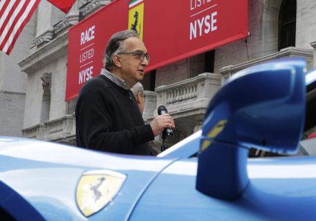 epa04987210 Sergio Marchionne, CEO of Fiat Chrysler Automobiles and the Chairman of CNH Industrial, outside the New York Stock Exchange on the first day of public trading of Ferrari in New York, New York, USA 21 October 2015. Shares in legendary Italian carmaker Ferrari are scheduled to begin trading 21 October on the New York Stock Exchange in an initial public offering (IPO) that could raise nearly 900 million dollars. Ferrari plans to offer 17.2 million shares. Their price will be 52 dollars (46 euros), Fiat Chrysler (FCA) confirmed Wednesday. This is at the top end of the predicted price range of between 48 and 52 dollars.  EPA/ANDREW GOMBERT