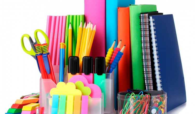 bright stationery and books isolated on white