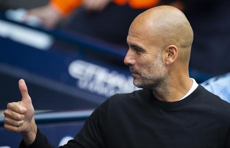 epa06958706 Manchester City manager Pep Guardiola reacts during the English Premier League soccer match between Manchester City and Huddersfield Town at the Etihad Stadium in Manchester, Britain, 19 August 2018.  EPA/PETER POWELL EDITORIAL USE ONLY. No use with unauthorized audio, video, data, fixture lists, club/league logos or 'live' services. Online in-match use limited to 75 images, no video emulation. No use in betting, games or single club/league/player publications