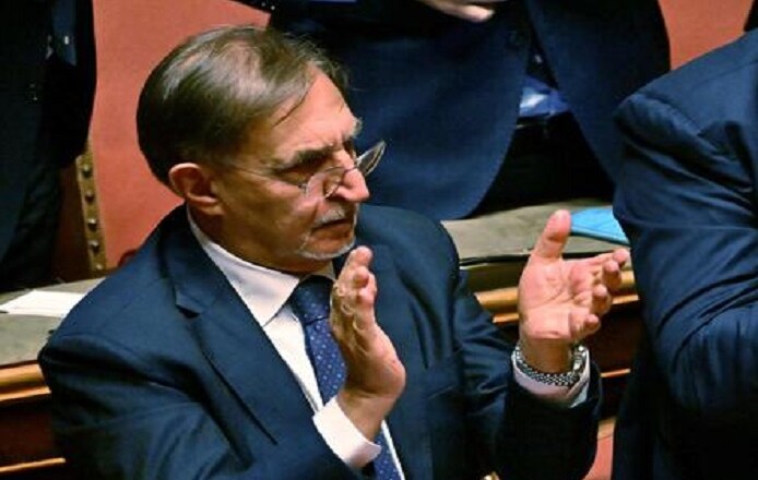 Italian far-right party "Fratelli d'Italia" (Brothers of Italy) member Ignazio La Russa (L) appaluds during the vote for the new president of the Senate following the general elections, on October 13, 2022. - Italian Senators and Deputies meet for the first time October 13, 2022, since elections to elect the new Presidents of the Parliament and the Senate. (Photo by Andreas SOLARO / AFP)