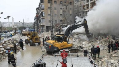 Rescue teams look for survivors under the rubble of a collapsed building after an earthquake in the regime-controlled northern Syrian city of Aleppo on February 6, 2023. - A 7.8-magnitude earthquake hit Turkey and Syria early on February 6, killing hundreds of people as they slept, levelling buildings and sending tremors that were felt as far away as the island of Cyprus, Egypt and Iraq. (Photo by AFP)